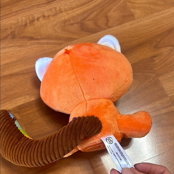 Orange and Blue Stuffed Raccoon Toy with Cartoonish Design - Picture 6 of 8